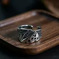 Macro shot of retro metal poker card relief ring featuring intricate woven side textures - J287 Playing Cards