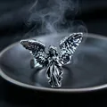 Detailed view of silver gothic ring featuring a carved angel design with mystical smoke - J288 Angel