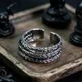 Close-up of vintage oxidized metal cuff bracelet with triple-layer curb chain weaving - J294 Woven Ring