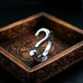 Polished silver question mark shaped adjustable metal ring for men displayed in a wooden box - J112 Question Mark