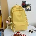 Minimalist yellow school backpack with nylon texture and cute plush pendant charm - Yellow With Brown Bear Charm