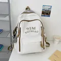 Off-white nylon student backpack with brown straps and checkerboard pendant charm - White