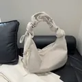 Chic cream corduroy hobo bag featuring elegant ruched handles and gold zipper details - Off White