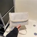 Minimalist cream fleece and leather crossbody bag with adjustable gold buckle detail - White