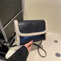 Black vintage lamb wool crossbody bag with white faux fur trim and adjustable strap - Black