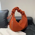 Bright orange corduroy hobo bag featuring a stylish ruched handle and gold zipper - Yellow Brown