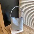 Light blue minimalist shoulder bag with 'Hope and future' embroidery and slim handle - Blue
