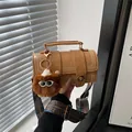 Retro tan Boston barrel bag with bohemian strap and plush charm for women - Brown