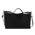 Chic black faux suede tote bag with brown leather trim and golden metal brand plate - Black