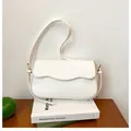 Elegant white PU leather underarm bag with unique wavy flap and slim shoulder strap - White