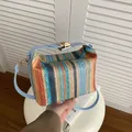 Rainbow woven straw crossbody bag with light blue leather strap and golden metal clasp - Rainbow Stripes / Blue