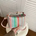Colorful striped woven crossbody straw bag with pink leather straps and gold hardware - Pink