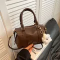 Dark brown Boston handbag in PU leather with plush charm and adjustable shoulder strap - With Plush Charm / Brown