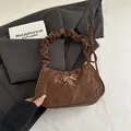 Brown bow shoulder bag with trendy wrinkled texture and ruffled strap design - Brown