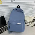Minimalist grey-blue nylon backpack with side pockets and a classic causal schoolbag design - Blue
