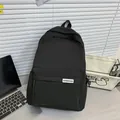 Minimalist all-black nylon backpack in Japanese style with XPENGDA brand label - Black