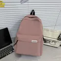Minimalist nylon pink backpack with large capacity for stylish students and commuters - Deep Pink