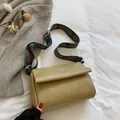 Olive green vintage messenger bag with white stitching and retro patterned strap - Khaki