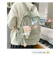 Detalle de una mochila escolar verde claro con lindos colgantes y pegatinas de astronautas - Solo Mochila (Sin Colgante) / Verde