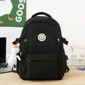 Black high-capacity nylon backpack with cute smile patch and white duck pendant detail - With Large White Duck Pendant / Black