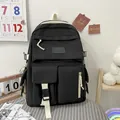 Sac à dos en toile noir avec plusieurs poches et sangles blanches pour étudiants - Style de base / Noir