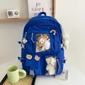 Detail of blue nylon backpack with cute plush charm and transparent pocket inserts - Blue