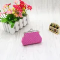 Close-up of a pink polka dot fabric coin purse with a vintage silver metal clasp closure - Rose Red
