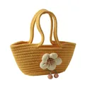 Bolso de mano tejido amarillo con flor de tela blanca grande y detalles de borlas rosas - Amarillo