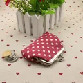Red retro fabric coin purse with white polka dots and silver metal clasp closure - Red