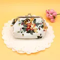 Vintage canvas coin purse with yellow floral pattern and silver metal clasp closure - White