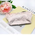 Vintage geborduurde lange damesportemonnee van champagneroze jacquard en metalen kusssluiting - Roze