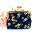 Detail of blue Japanese coin purse with golden cherry blossom pattern and metal clasp - Navy Blue