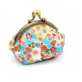 Macro detail of sky blue Japanese floral cotton purse with bronze metal clasp - Blue