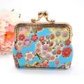 Detail of blue Japanese floral fabric coin purse with cherry blossom pattern and metal clasp - Blue