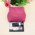 Rose red fabric coin purse with vintage metal clasp next to coins and lipstick - Rose Red