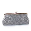 Detailed view of grey geometric canvas clutch featuring vintage metal frame and clasp - Dark Gray