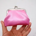 Pink satin coin purse with silver kiss-lock held in hand showing its mini size - Pink / 3 Inch
