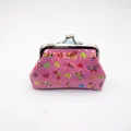 Detailed view of pink sequin coin purse with butterfly prints and metal clasp closure - Rose Red