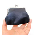 Close-up of a mini black coin purse with silver metal clasp held in hand for scale - Black / 3 Inch