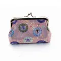 Close-up of pink sequin coin purse with cartoon lion print and silver metal clasp - 4 Inch / Pink