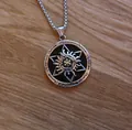 Macro view of a retro hexagram sun pendant with black enamel on a box chain - Solar Hexagram + Steel Chain