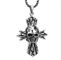 Detailed macro view of a silver punk skull and cross pendant with gothic flame carvings - Giant Ghost Cross