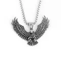 Detailed close-up of eagle pendant showing intricate feather textures and box chain link - Soaring Eagle Style