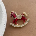 Exquisite rocking horse brooch with red enamel and crystals on a gold alloy base - Burgundy