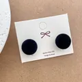 Detail of black velvet flocking ball earrings with S925 silver studs on jewelry card - Black