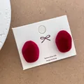 Detailed view of red flocked irregular earrings on a 925 silver stud display card - Irregular Small Style