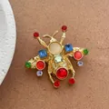Spilla a forma di ape vintage in oro con cristalli colorati e strass per giacche - Insetto con Strass Dorato