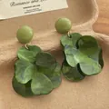 Detailed close-up of dark green floral earrings with marble texture petals and gold links - Army Green (E206)
