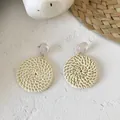 Detailed view of handmade cream rattan hoop earrings with white resin studs and spiral texture - New Rattan Woven 21 (White Dome Spiral Weave)