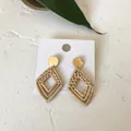 Handmade woven rattan double rhombus drop earrings with golden studs on white background - Diamond Rattan Style